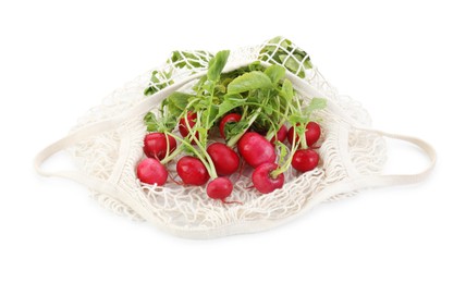 String bag with radishes isolated on white