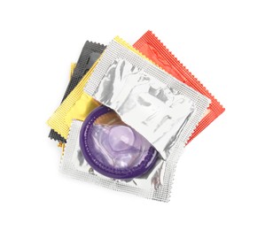 Photo of Condom packages on white background, top view. Safe sex