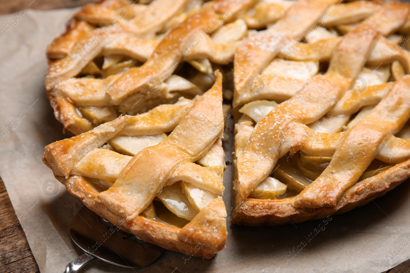 Photo of Delicious traditional apple pie on table, closeup