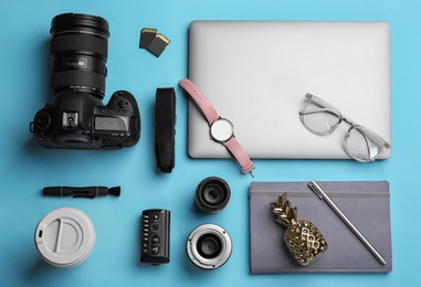 Flat lay composition with photographer's equipment and accessories on color background