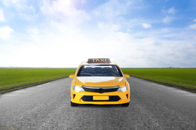 Image of Yellow taxi car on asphalt highway outdoors 