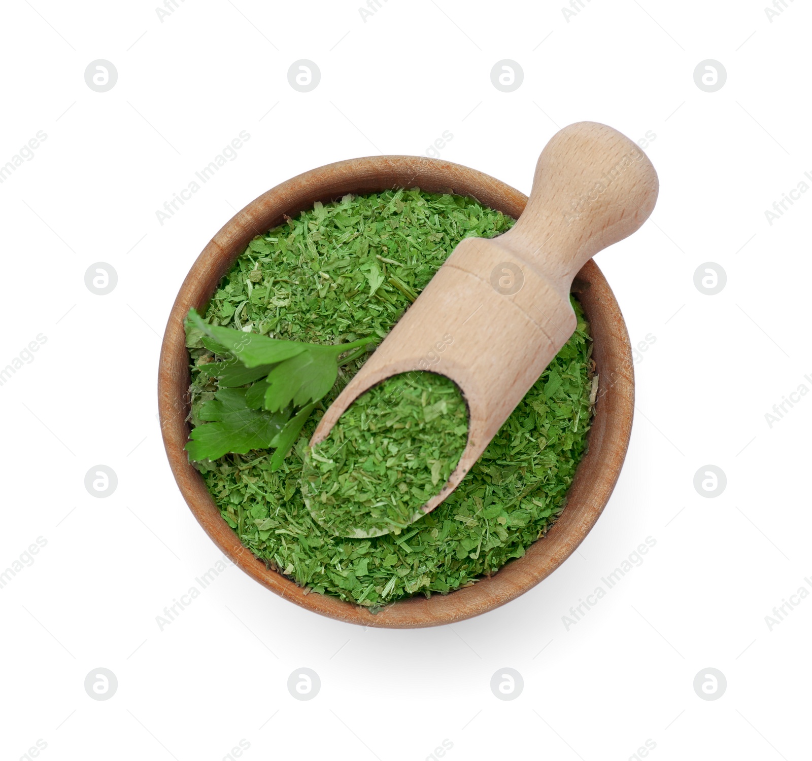 Photo of Dried and fresh parsley with scoop in bowl isolated on white, top view