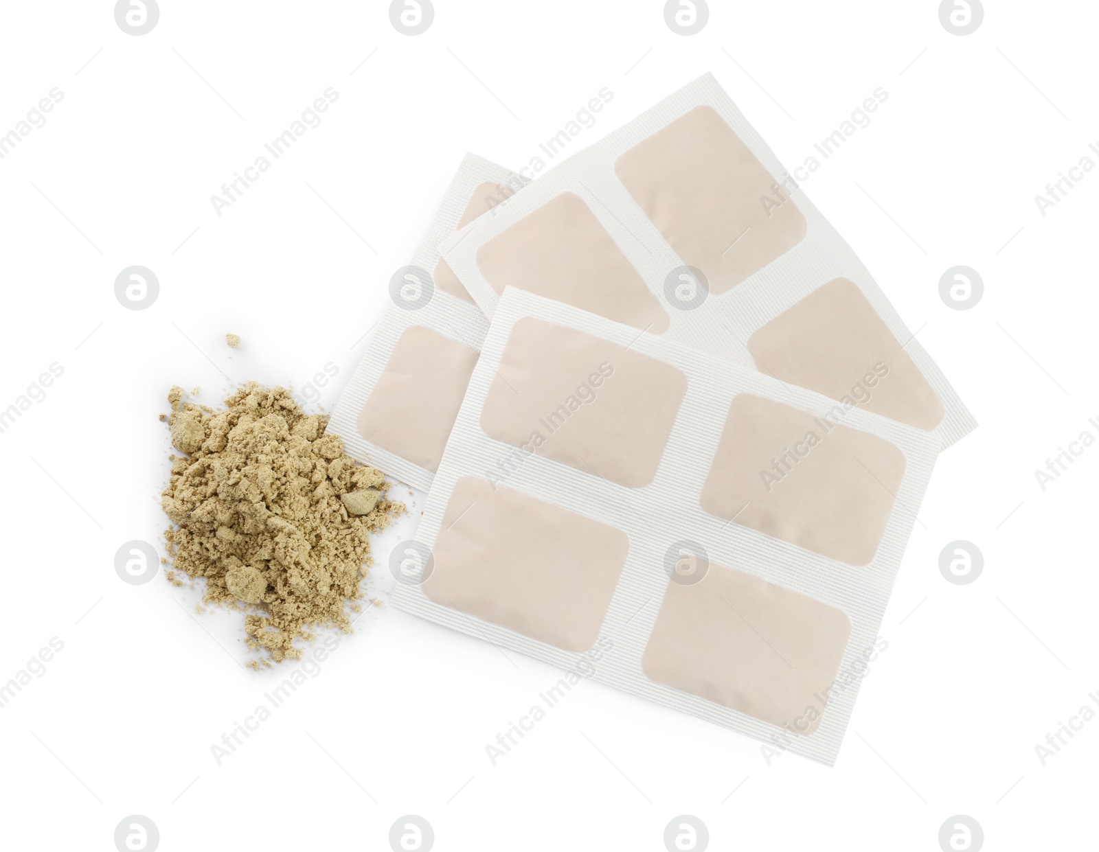 Photo of Mustard powder and plasters on white background, top view