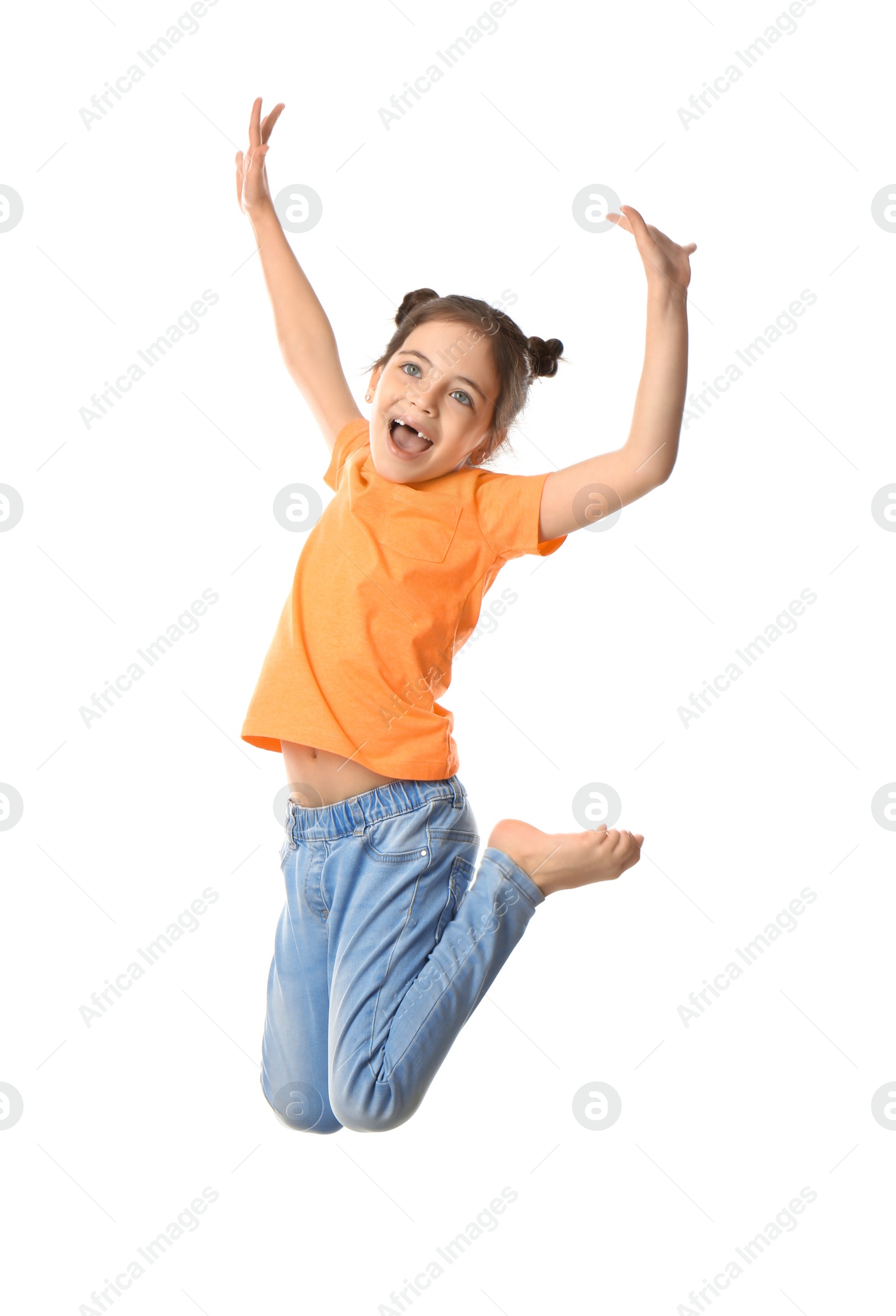 Photo of Cute little girl jumping on white background