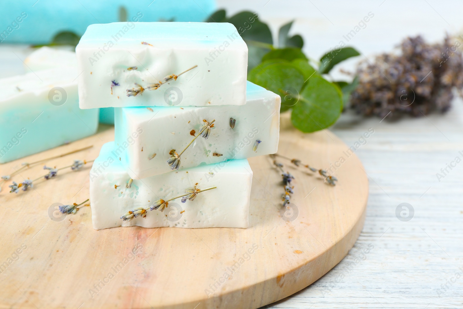 Photo of Natural handmade soap bars on white wooden table