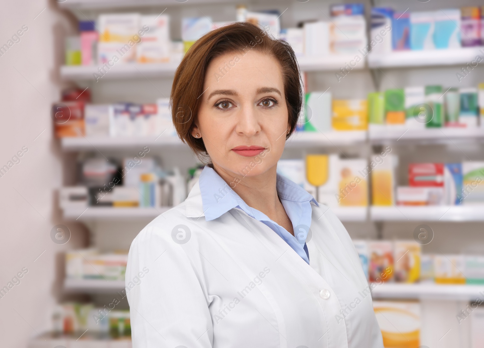 Image of Portrait of professional pharmacist in modern drugstore