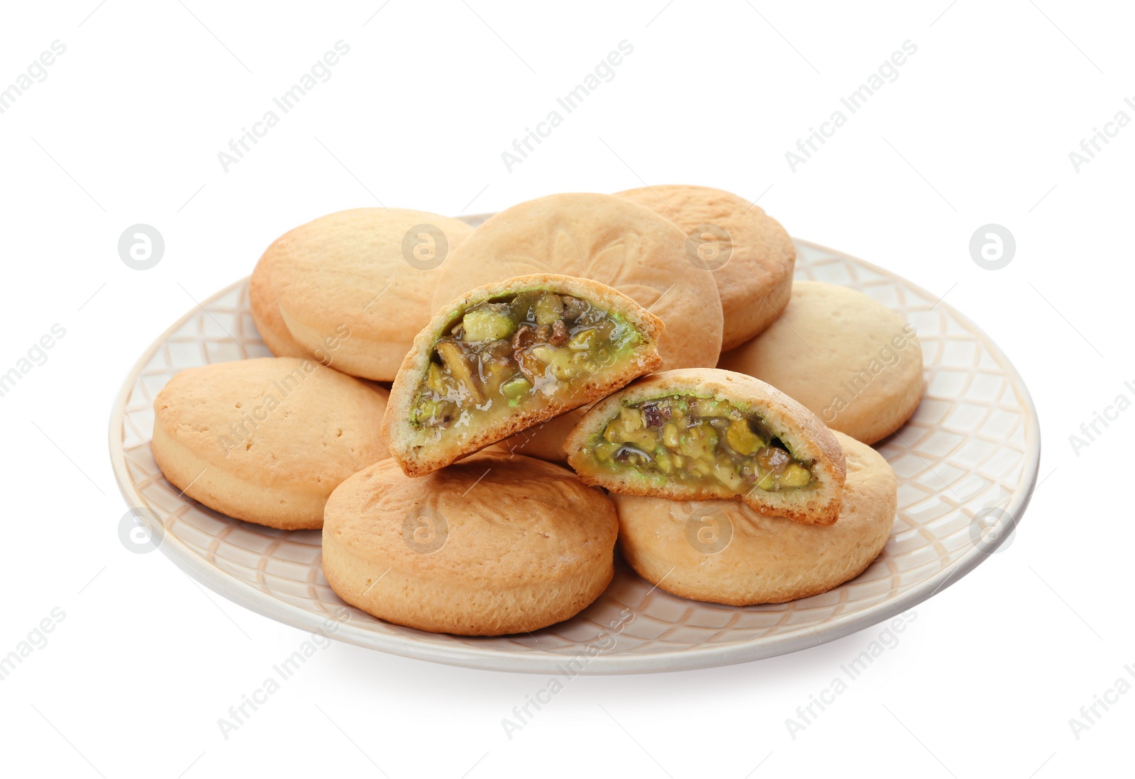 Photo of Plate with traditional cookies for Islamic holidays isolated on white. Eid Mubarak