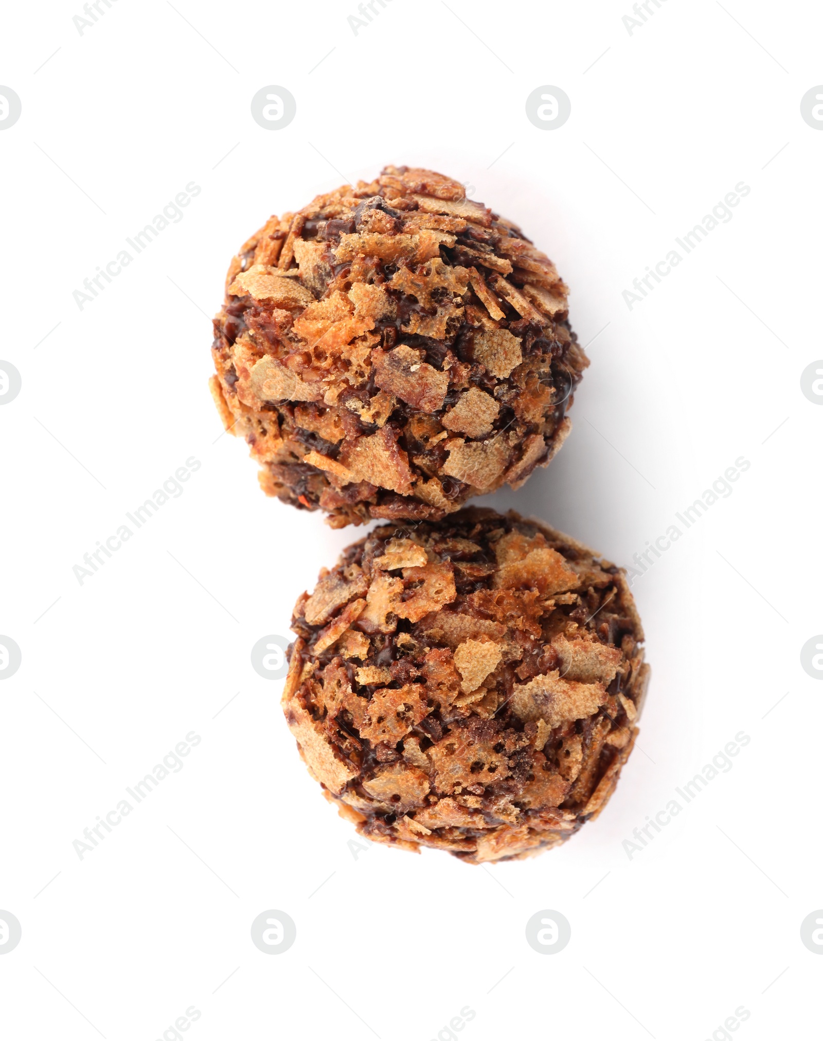 Photo of Delicious chocolate candies with waffle crumbles isolated on white, top view