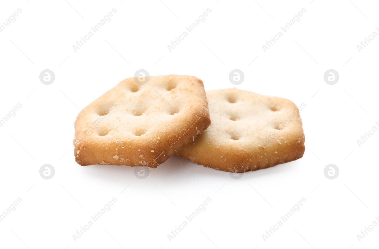 Photo of Crispy crackers isolated on white. Delicious snack