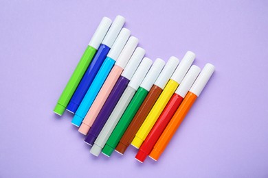 Photo of Different colorful markers on light background, flat lay