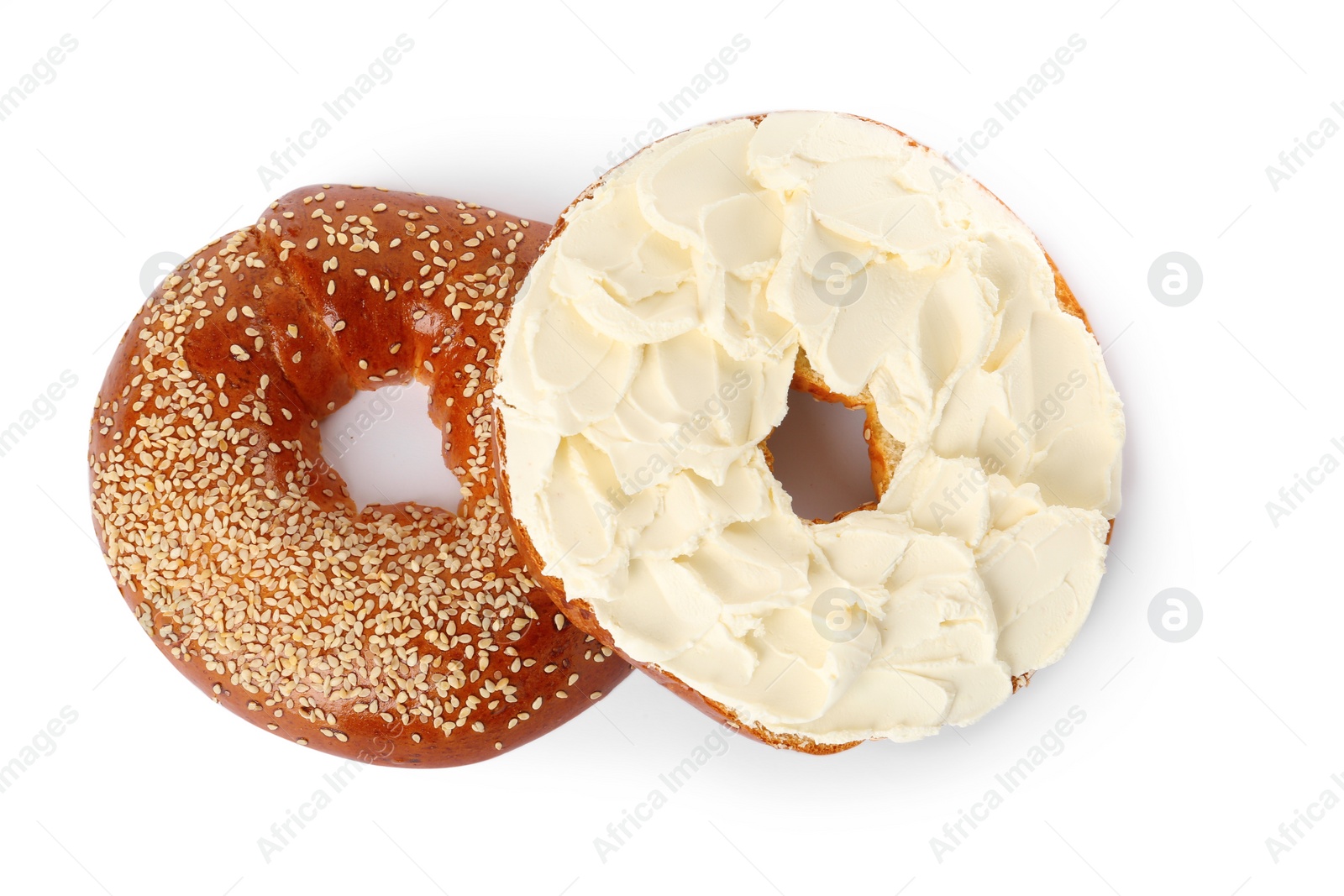 Photo of Delicious fresh bagel with cream cheese on white background, top view