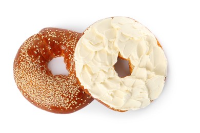 Photo of Delicious fresh bagel with cream cheese on white background, top view