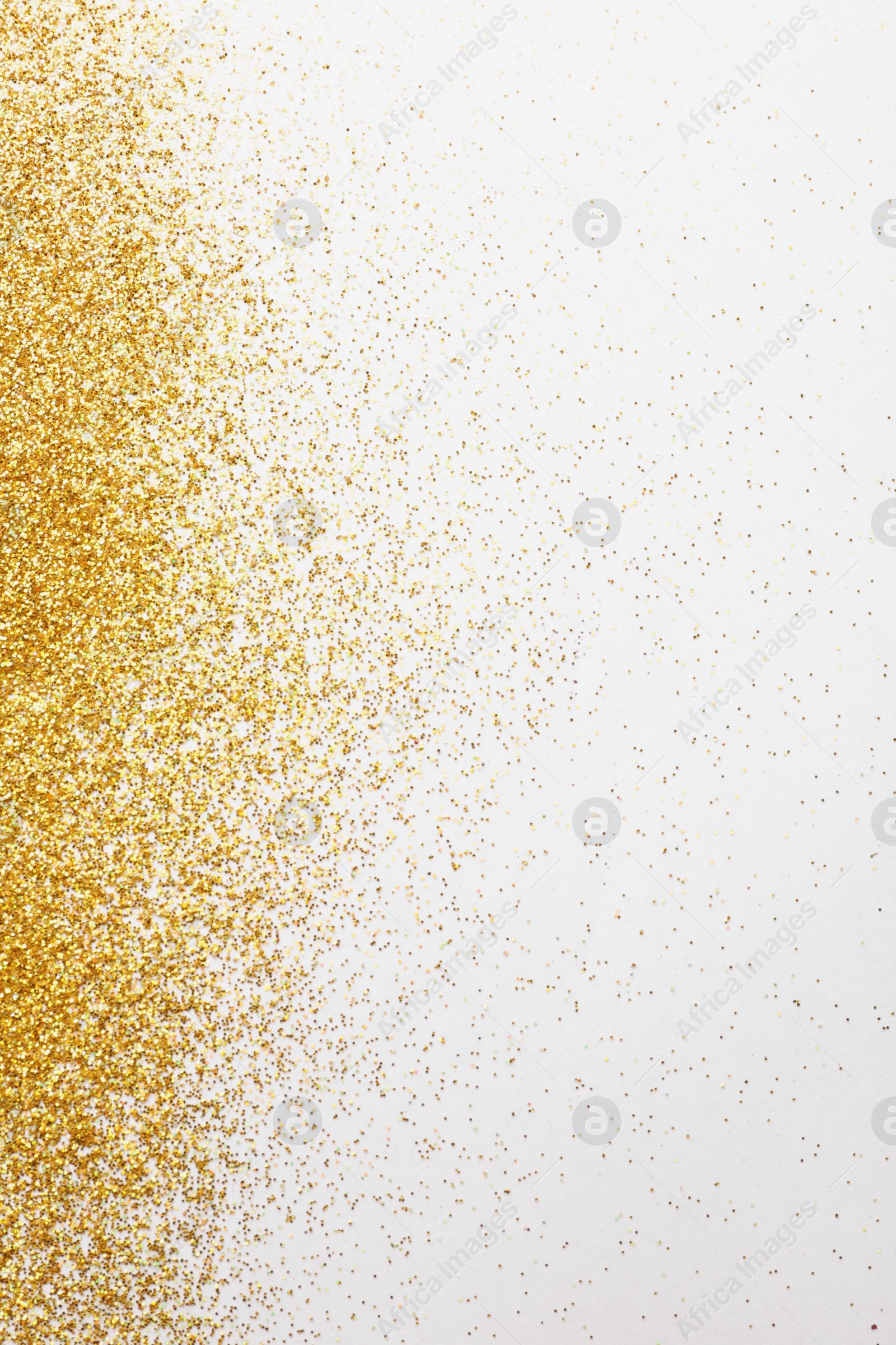 Photo of Golden glitter on white background, top view