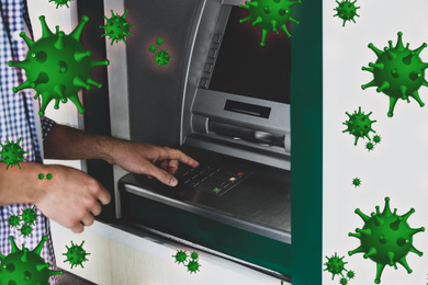 Image of Use cash machine careful during coronavirus outbreak. Man withdrawing money at ATM