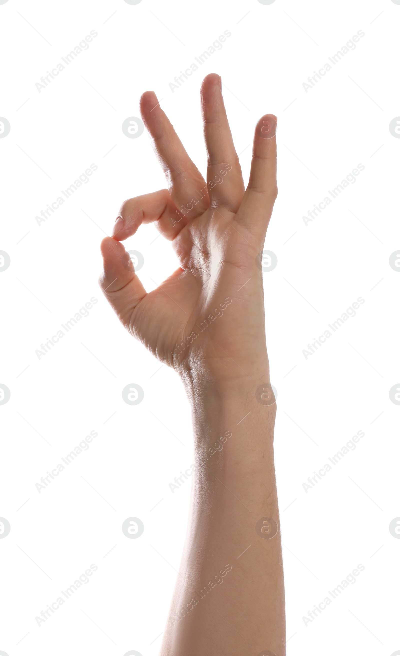 Photo of Man showing okay gesture against white background, closeup of hand