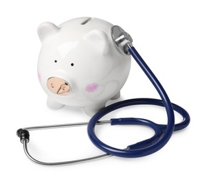 Piggy bank with stethoscope on white background. Medical insurance