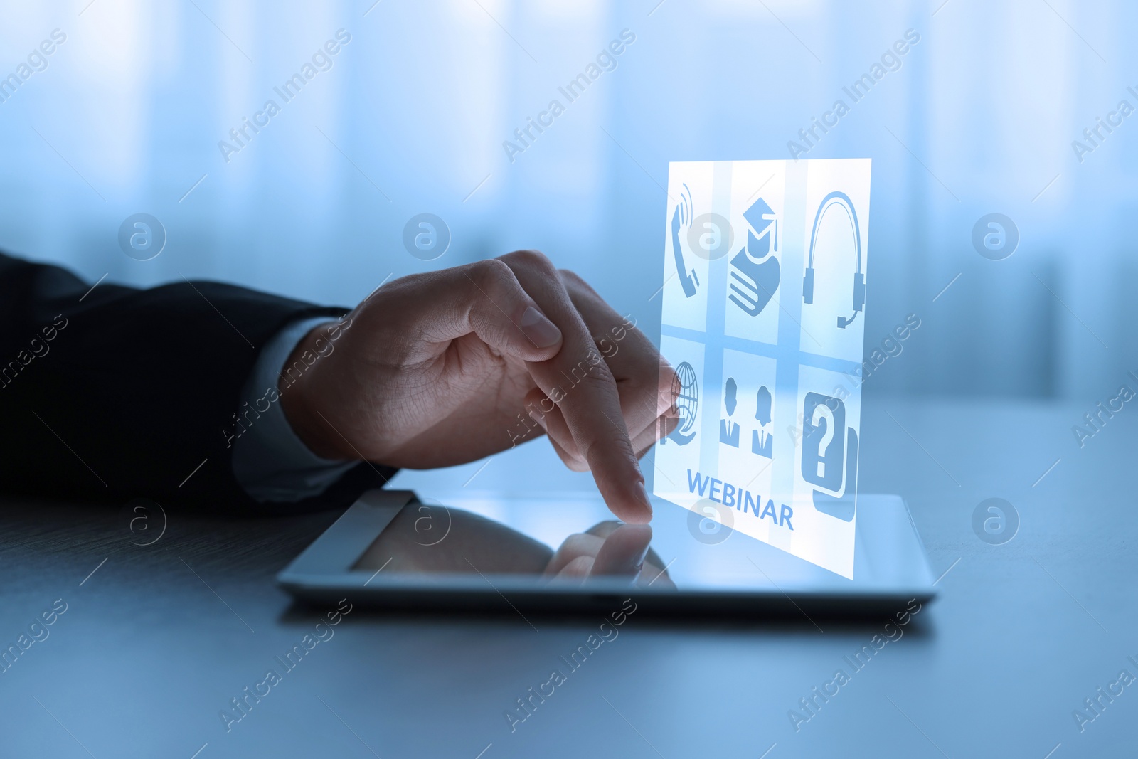 Image of Webinar. Man using tablet at table, closeup. Virtual screen with icons over computer