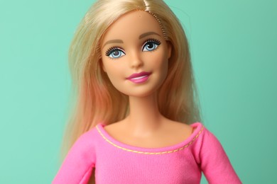 Photo of Mykolaiv, Ukraine - September 2, 2023: Beautiful Barbie doll on turquoise background