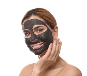 Beautiful woman with black mask on face against white background