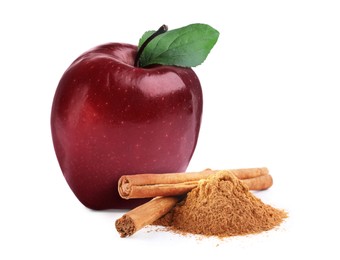 Aromatic cinnamon sticks, powder and red apple isolated on white