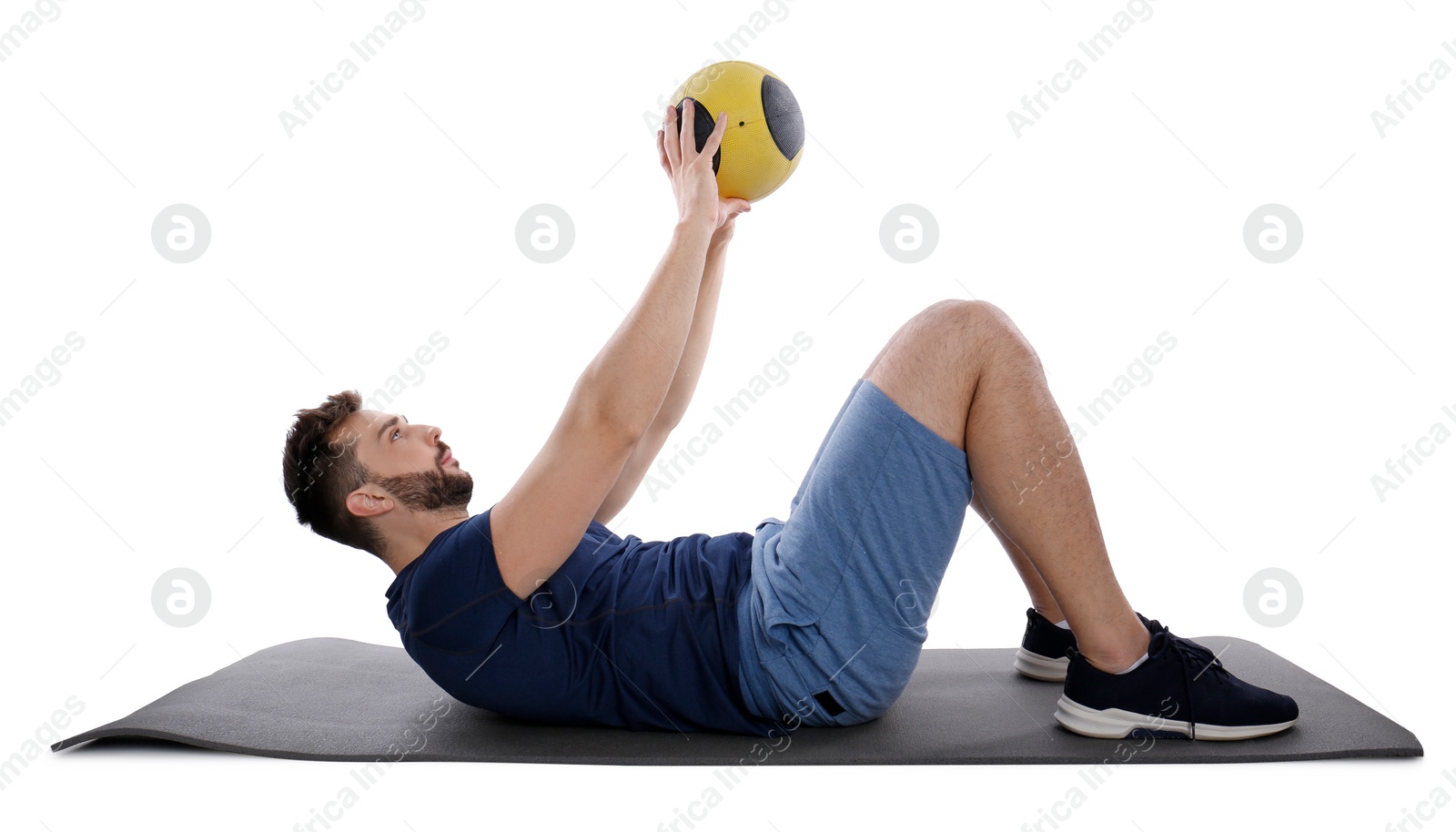 Photo of Athletic man doing exercise with medicine ball isolated on white