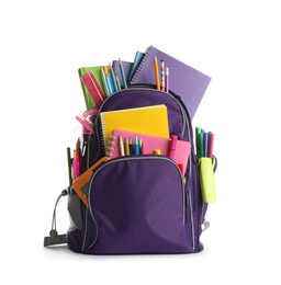 Photo of Purple backpack with different school supplies isolated on white