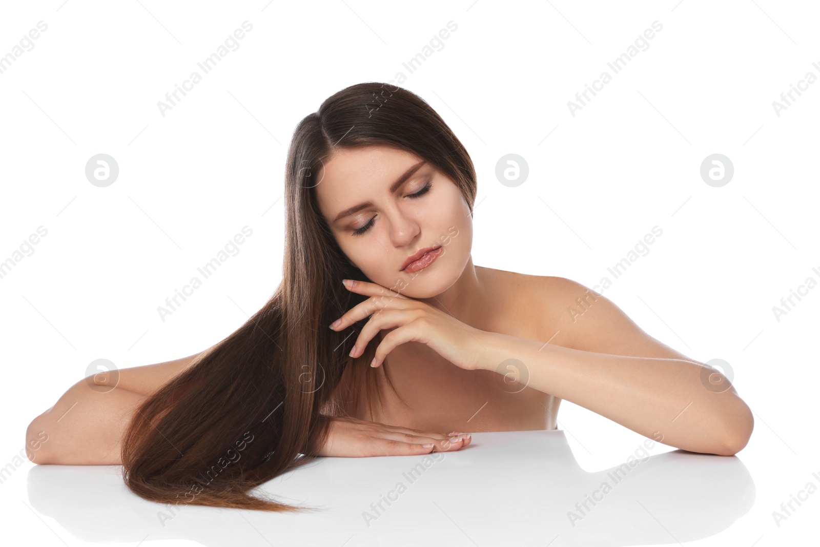 Photo of Young woman with strong healthy hair on white background