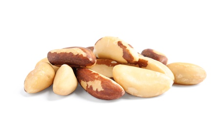 Photo of Pile of tasty Brazil nuts on white background