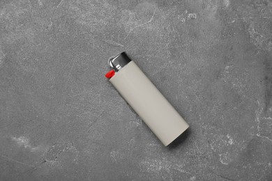 Photo of Stylish small pocket lighter on grey table, top view