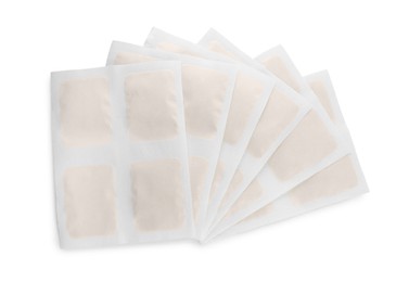 Mustard plasters on white background, top view