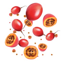 Image of Delicious exotic tamarillo fruits flying on white background 