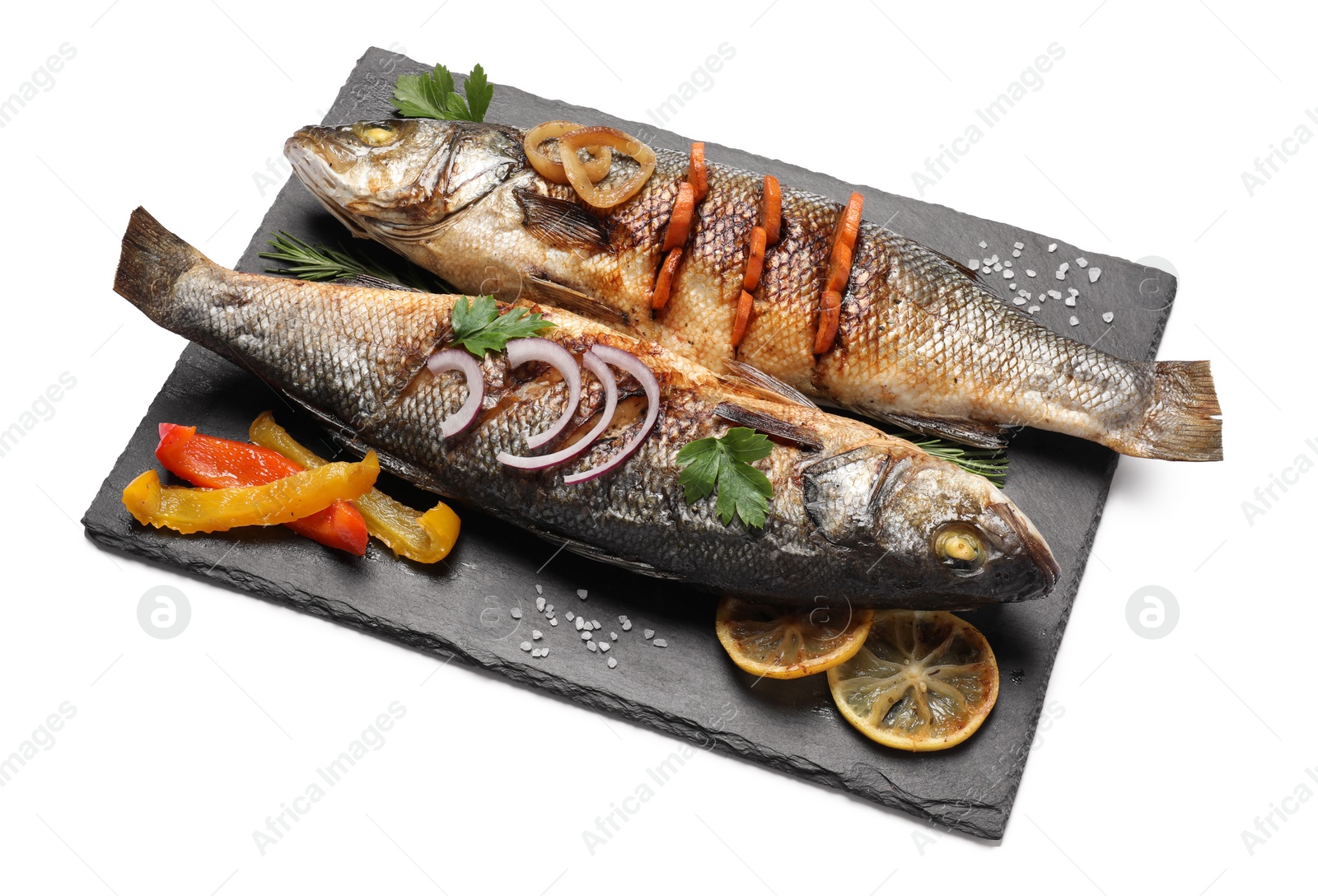 Photo of Delicious sea bass fish and ingredients isolated on white