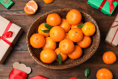 Photo of Flat lay composition with tangerines on wooden background