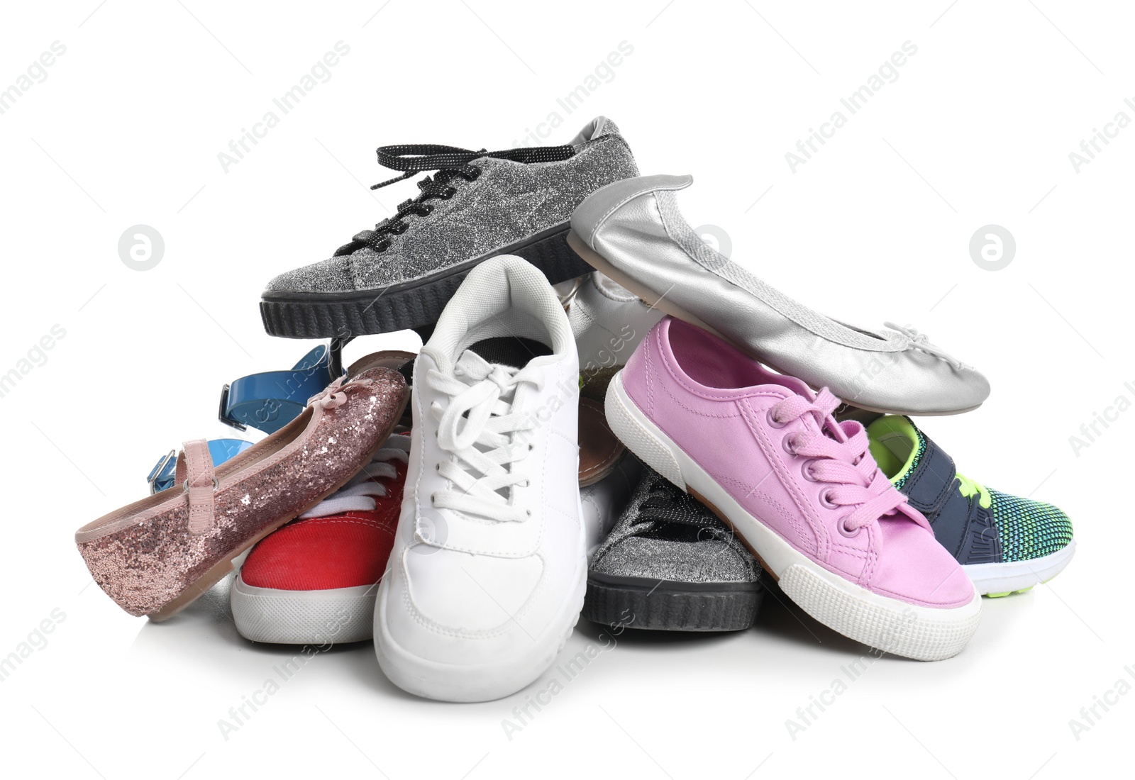 Photo of Pile of different shoes on white background