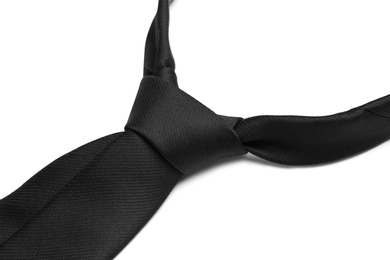 Photo of Stylish black male necktie isolated on white, closeup