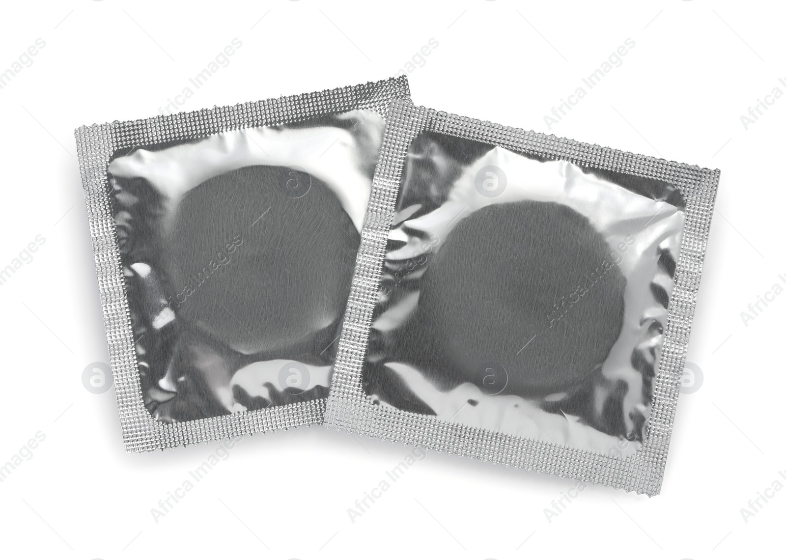 Photo of Condom packages isolated on white, top view. Safe sex