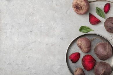 Photo of Flat lay composition with ripe beets on grey background