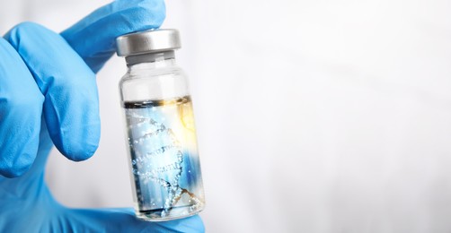 Image of Genetics research. Scientist holding vial with liquid and illustration of DNA structure, closeup. Banner design with space for text