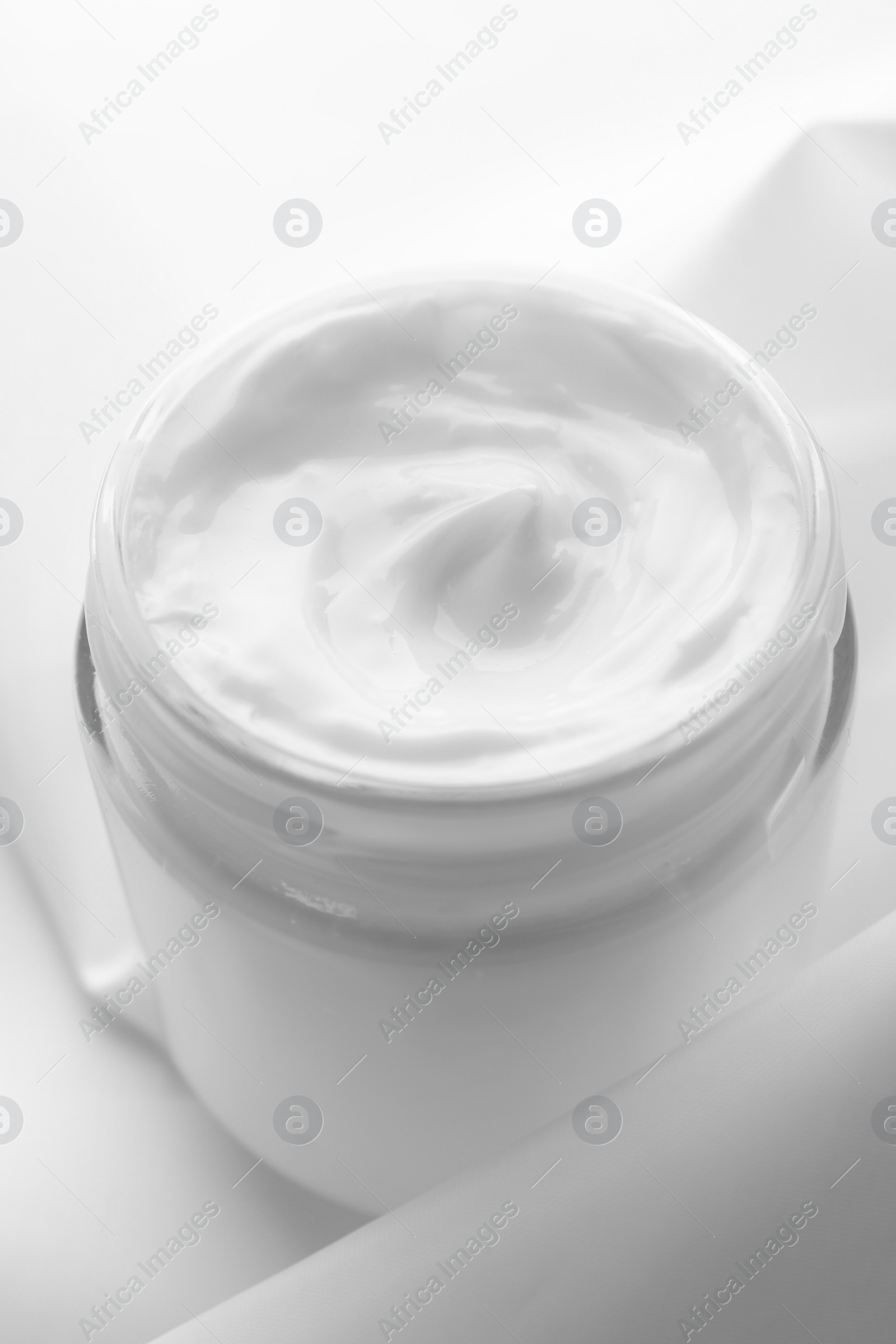 Photo of Jar of hand cream on white background, closeup