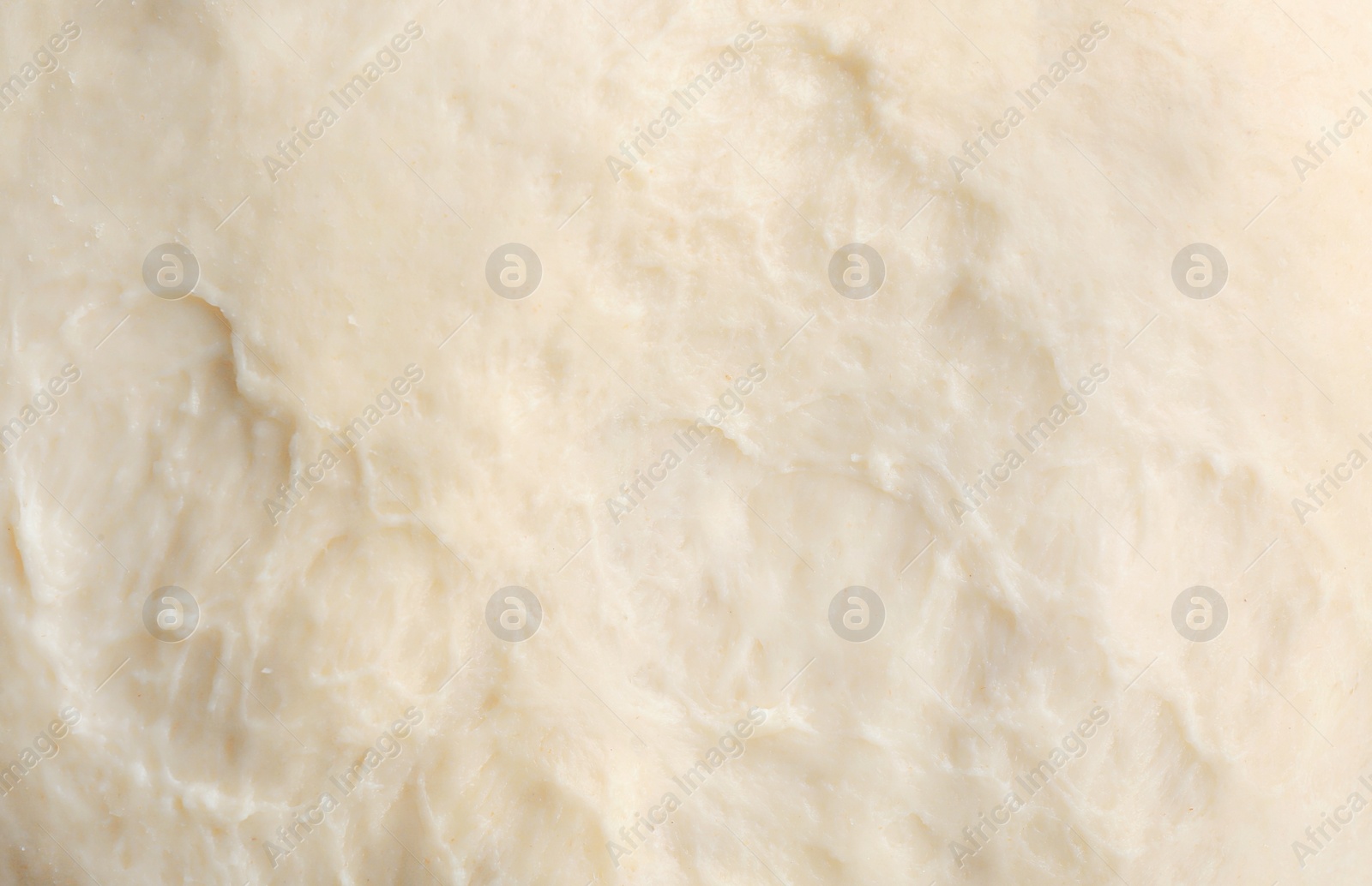 Photo of Fresh raw dough as background, closeup