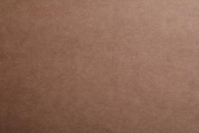 Photo of Texture of kraft paper bag as background, closeup