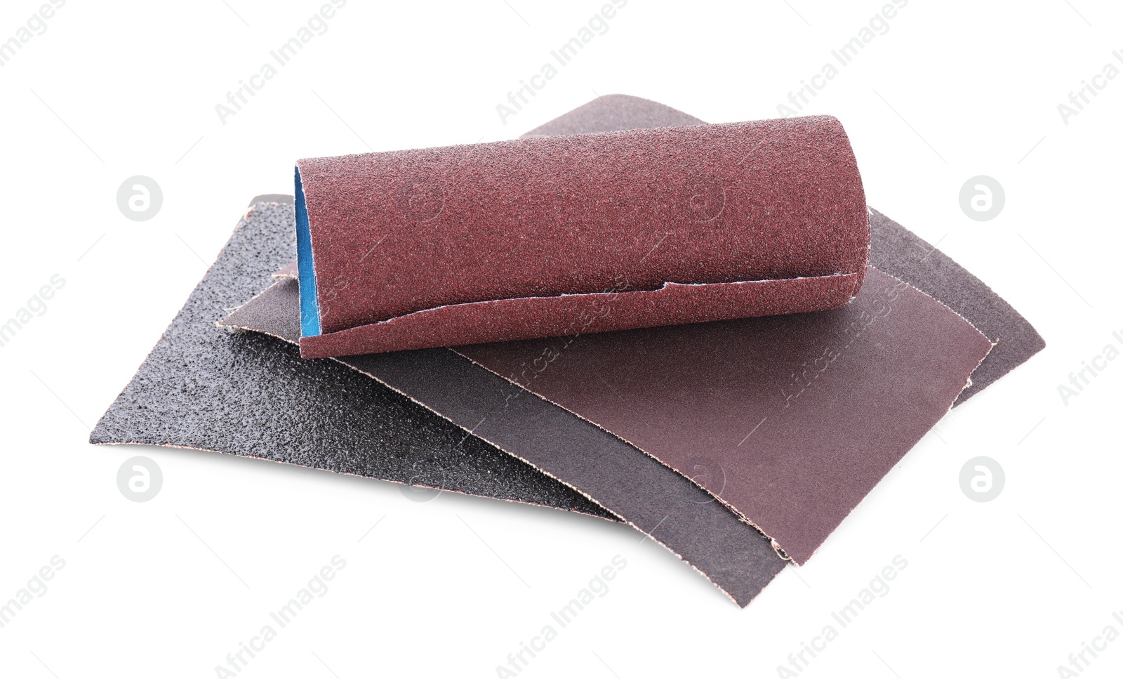 Photo of Many sheets of sandpaper isolated on white