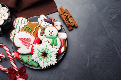 Photo of Delicious Christmas cookies on black table, flat lay. Space for text