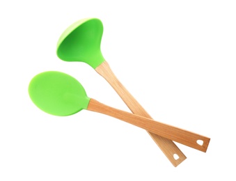 Photo of Spoon and soup ladle with wooden handles on white background