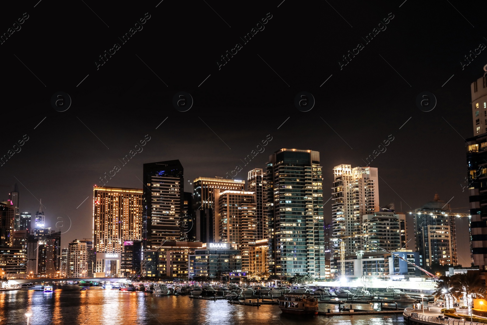 Photo of DUBAI, UNITED ARAB EMIRATES - NOVEMBER 03, 2018: Night cityscape of marina district with illuminated buildings