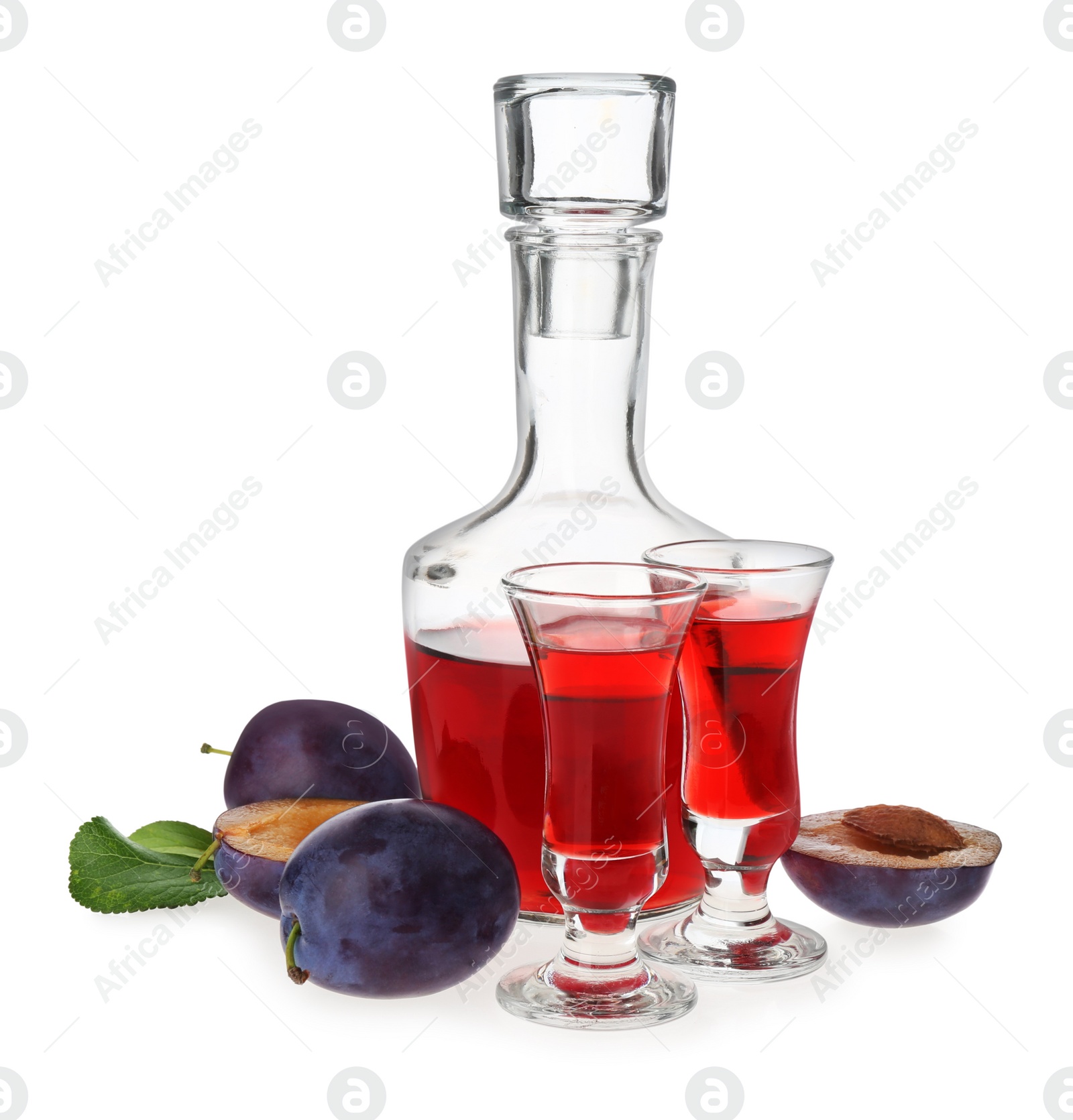 Photo of Delicious plum liquor and ripe fruits on white background. Homemade strong alcoholic beverage