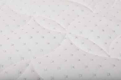 Image of Modern comfortable orthopedic mattress as background, closeup