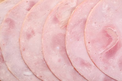 Slices of tasty ham as background, top view