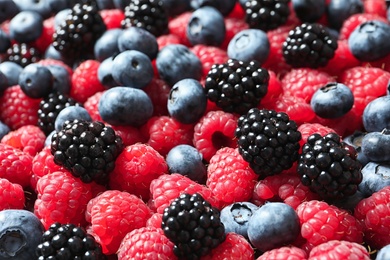 Photo of Raspberries, blackberries and blueberries as background