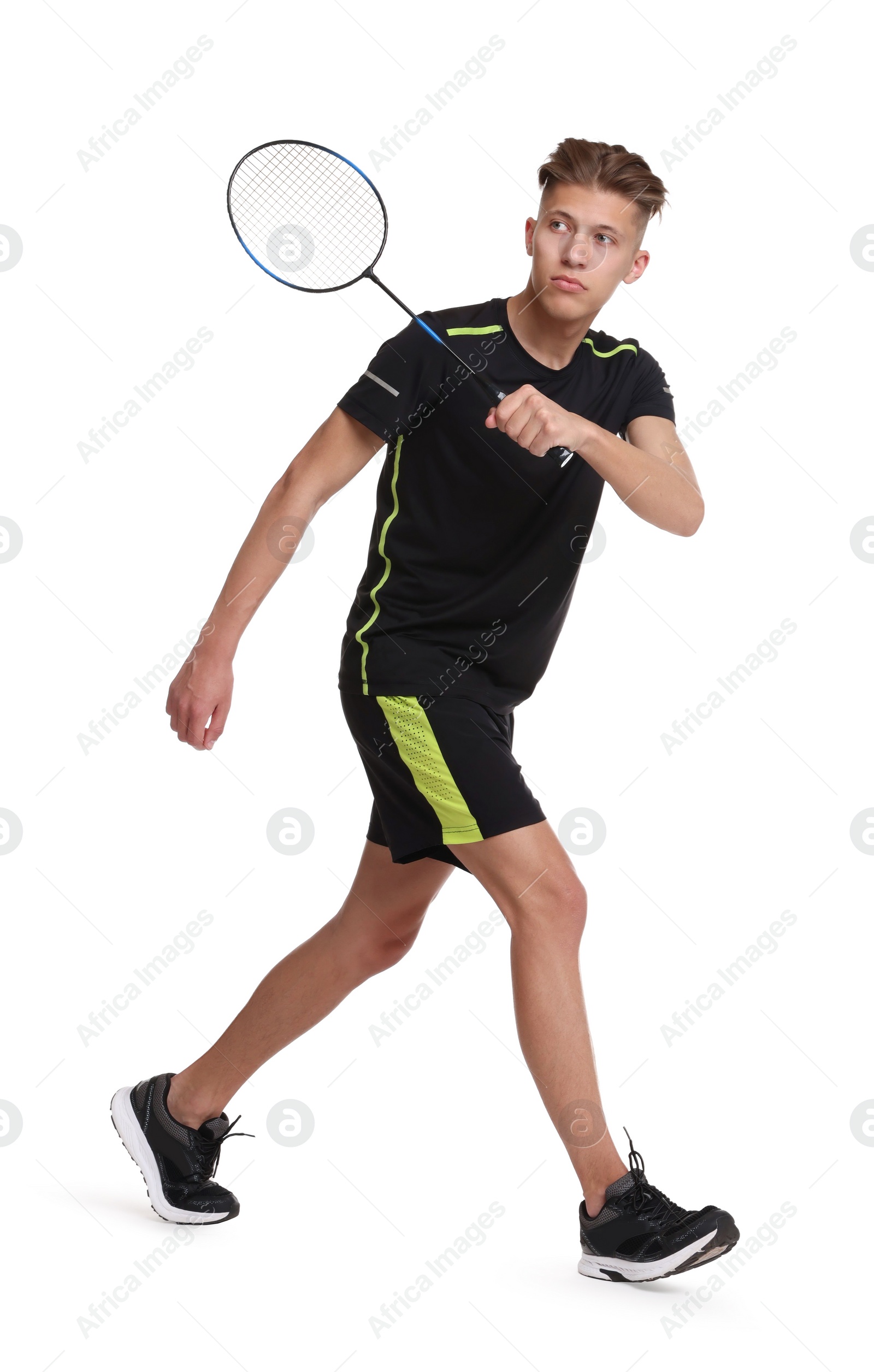 Photo of Young man playing badminton with racket on white background